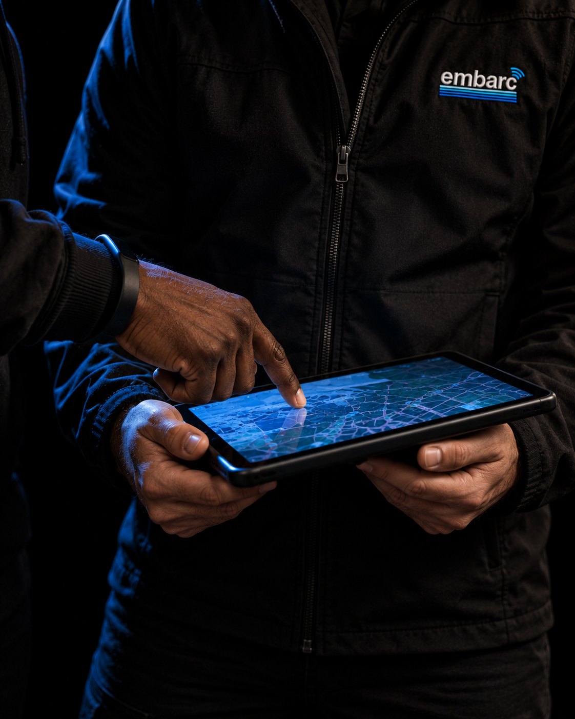 Two Embarc reps planning the day's route on a tablet